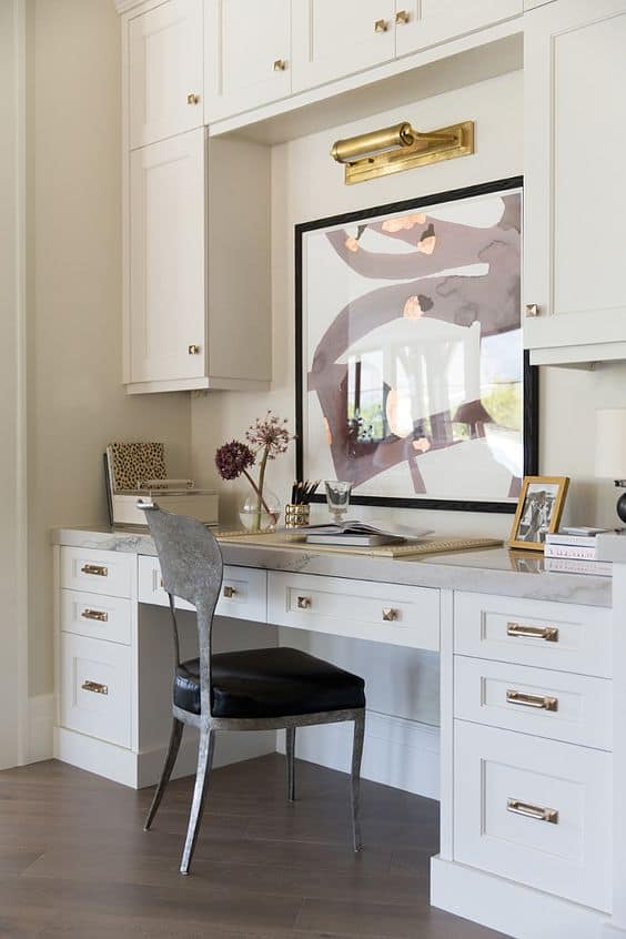White Desk with Marble Countertop and Art Display